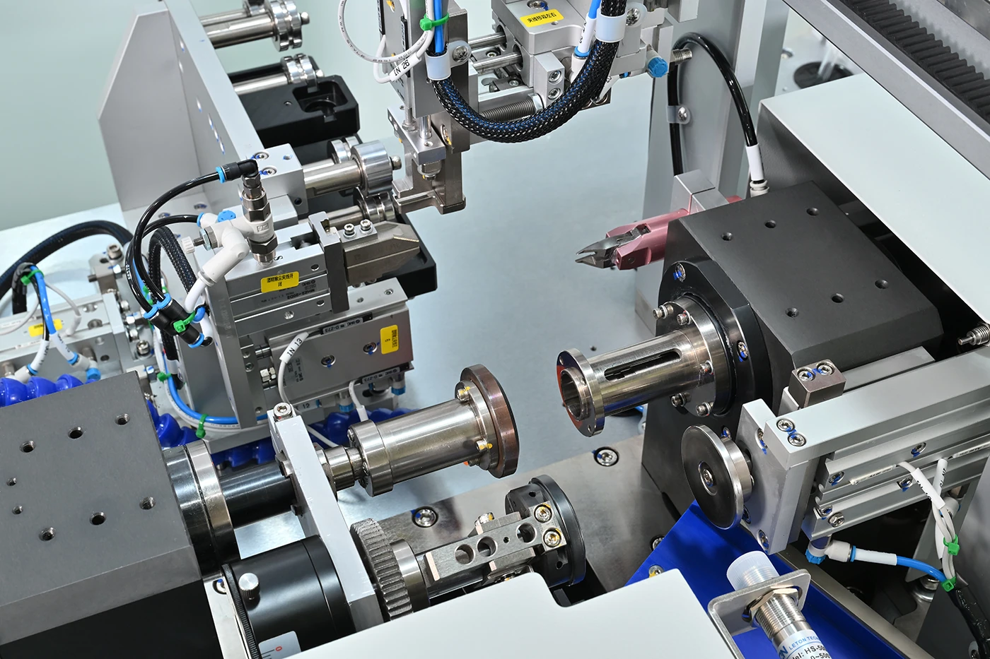 Close-up winding process detail with wire path and tooling
